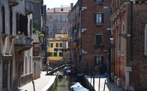 Narrow street amidst buildings in town