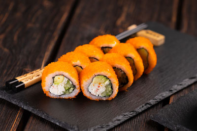 Close-up of sushi on cutting board