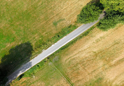 High angle view of road amidst field