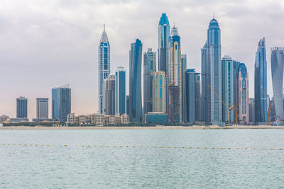 Modern buildings in city against sky