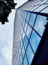 Captured. a gridded reflection from a pedestrian angle.