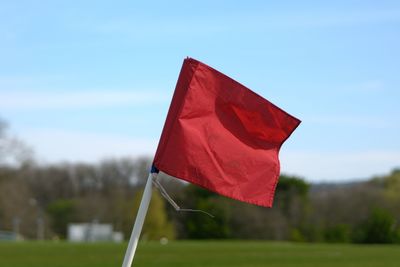Close-up of red flag against blurred background
