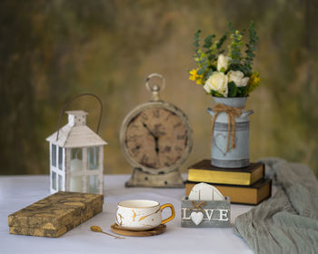 Close-up of roses in vase on table