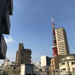 Low angle view of buildings in city against sky