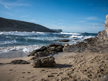 Scenic view of beach against sky