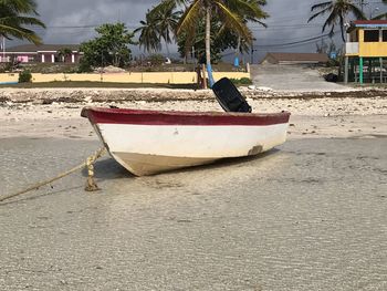 Boat moored on beach