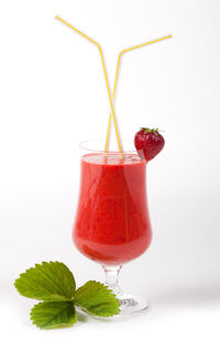 Red fruit against white background