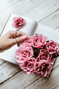 High angle view of hand holding rose bouquet
