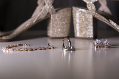 Close-up of wedding rings on table