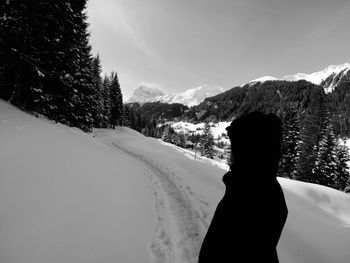 Scenic view of snow covered mountains against sky