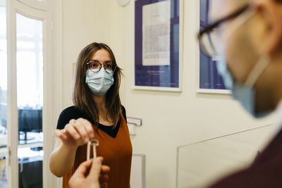 Portrait of woman holding camera