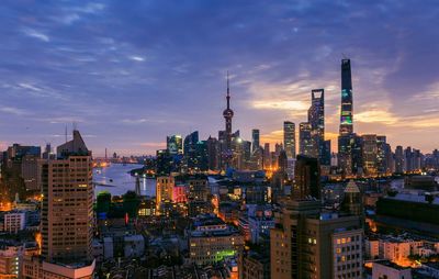 City skyline against cloudy sky