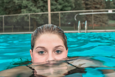 Portrait of woman swimming in pool