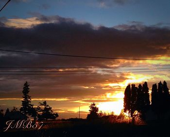 Low angle view of cloudy sky at sunset