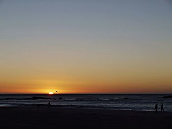 Scenic view of sea at sunset