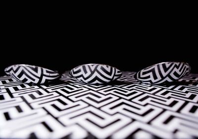 Close-up of abstract pattern against black background