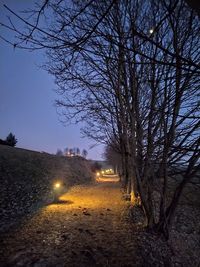 View of illuminated street at night