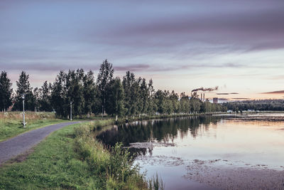 Scenic view of lake against sky at sunset