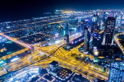 Aerial view of illuminated cityscape at night