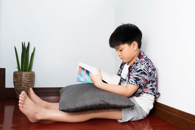 Boy sitting at home