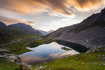 Scenic view of lake and mountains against sky