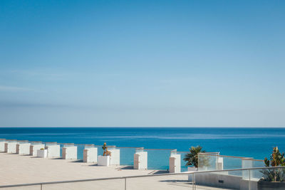 Scenic view of sea against clear blue sky