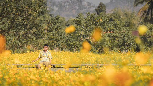 Man sitting on field