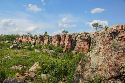 Rock formations on landscape during sunny day