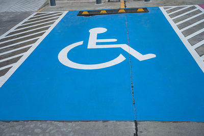 High angle view of disable access sign on road