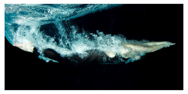 Person swimming in pool