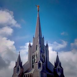 Low angle view of church against cloudy sky