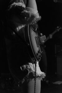 Close-up of man playing guitar