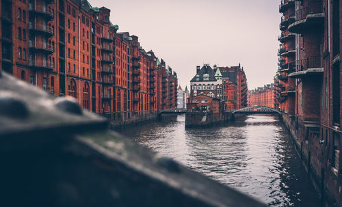 Speicherstadt, city of warehouse, with steel bridge and the canal in cloudy day, hamburg