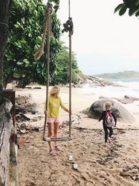 Rear view of women on beach