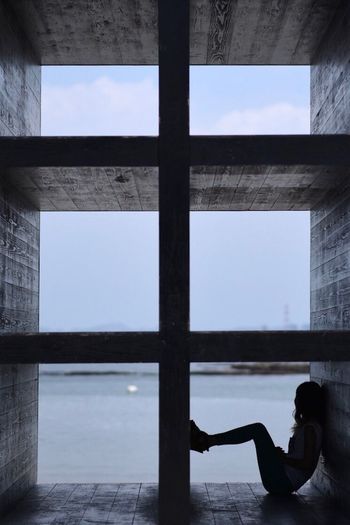 REFLECTION OF MAN ON WINDOW