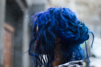 Close-up of woman with dyed blue hair