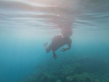 Man scuba diving in sea