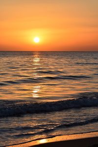 Scenic view of sea against romantic sky at sunset