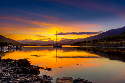 Scenic view of lake during sunset