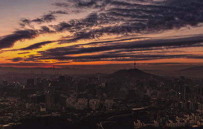 High angle view of city at sunset