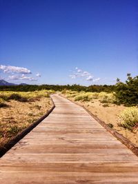 Surface level of dirt road along countryside landscape