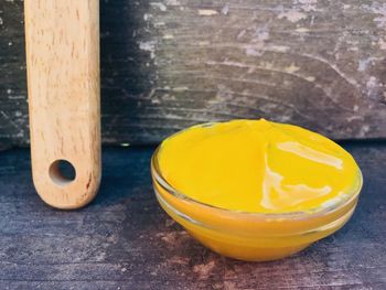 High angle view of yellow juice on table