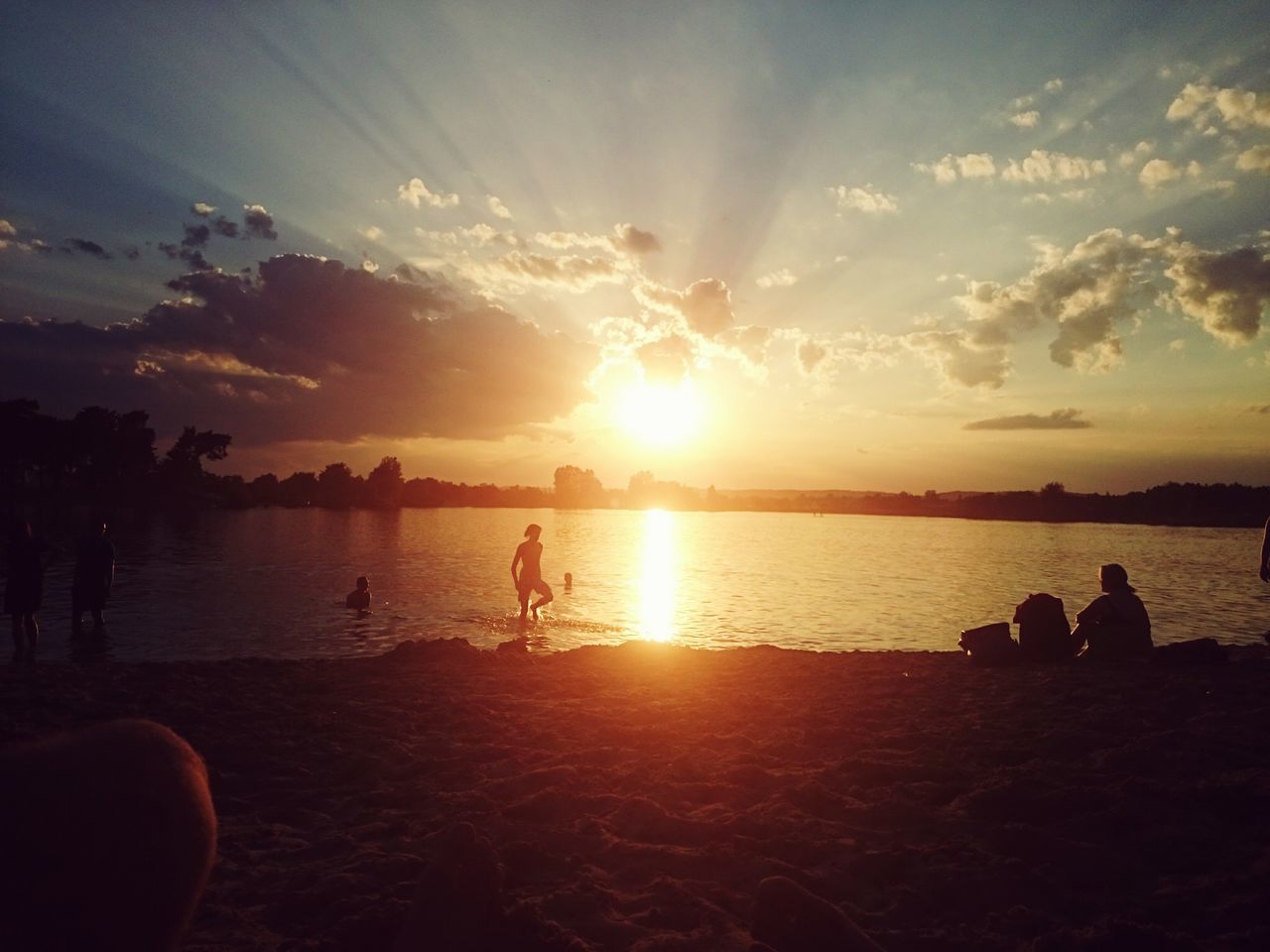 sun, sunset, water, sea, scenics, tranquil scene, sky, beach, beauty in nature, tranquility, leisure activity, sunlight, lifestyles, nature, silhouette, idyllic, shore, men, reflection