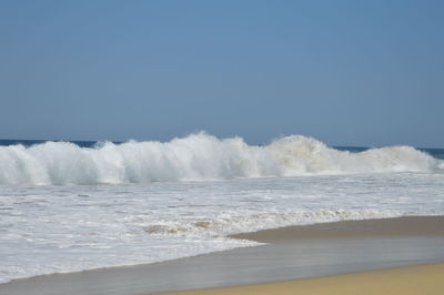 Scenic view of sea against clear sky