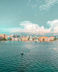 City by sea against sky