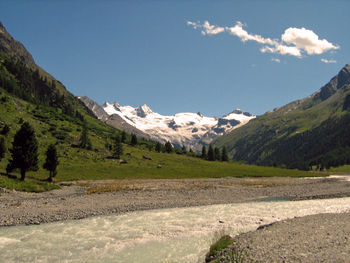 Scenic view of landscape and mountains against sky