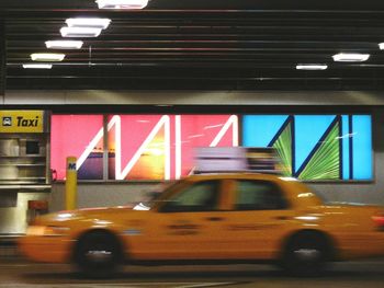 Blurred motion of car on illuminated city at night