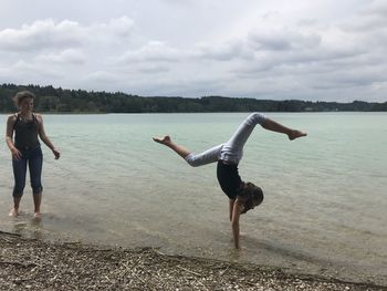 Full length of man on lake against sky