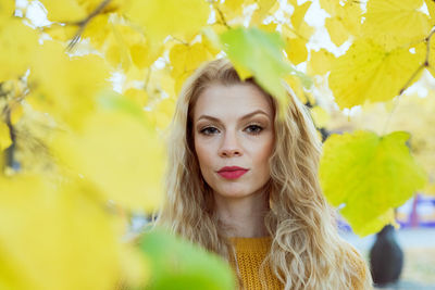 Portrait of woman with yellow eyes closed