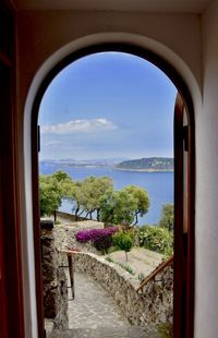 Scenic view of landscape seen through window